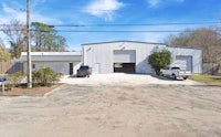 a garage with a car parked in front of it